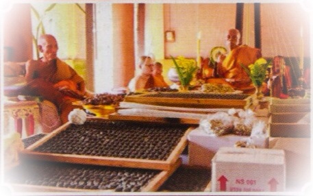 Buddhist guru monks of the Luang Por Tuad lineage, performing blessings of amulets